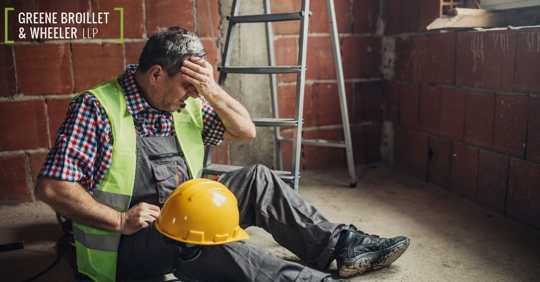 Construction worker who has fallen off a ladder and is injured